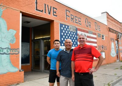 John Wheatley, owner/founder of L&W Bedding; Jose Beltran, co-owner; and Owen Beltran, quality control manager, use for a photo outside the companyÕs Moline, Illinois factory. All of L&WÕs mattresses are made to order in the Moline factory. The building is affectionally referred to in the neighborhood as the ÔLive Free or Die building.Õ